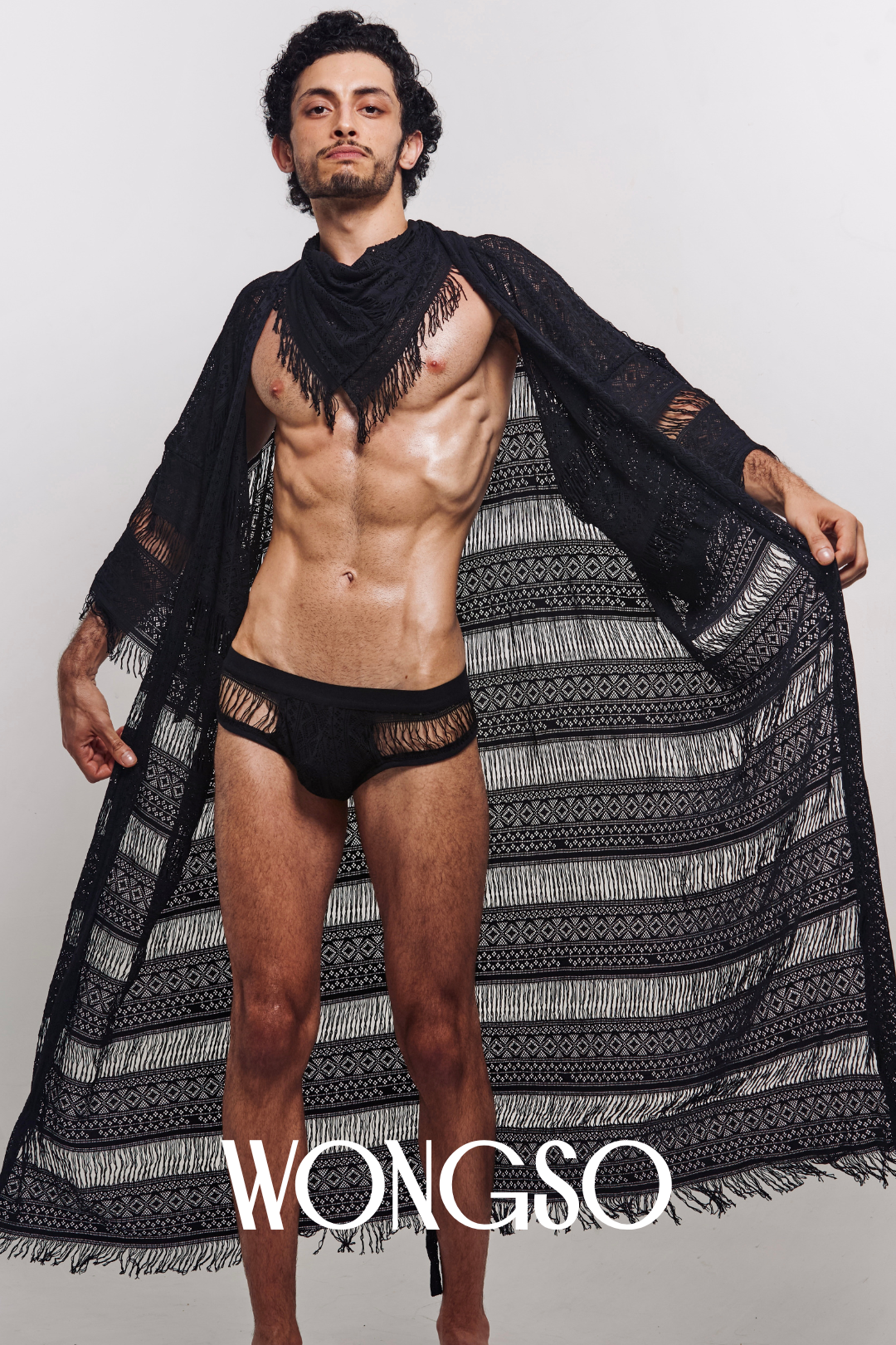 Model in Fringe Black Lace Robe standing – men's festival robe