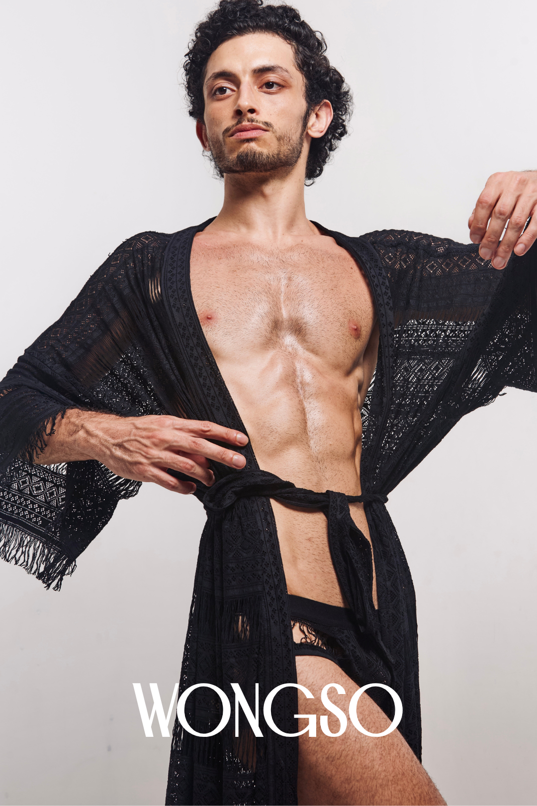 Close-up of lace and fringe details on black robe