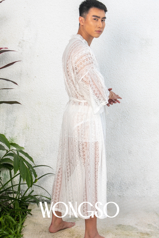 Sheer white lace kimono floating in daylight – elegant queer fashion