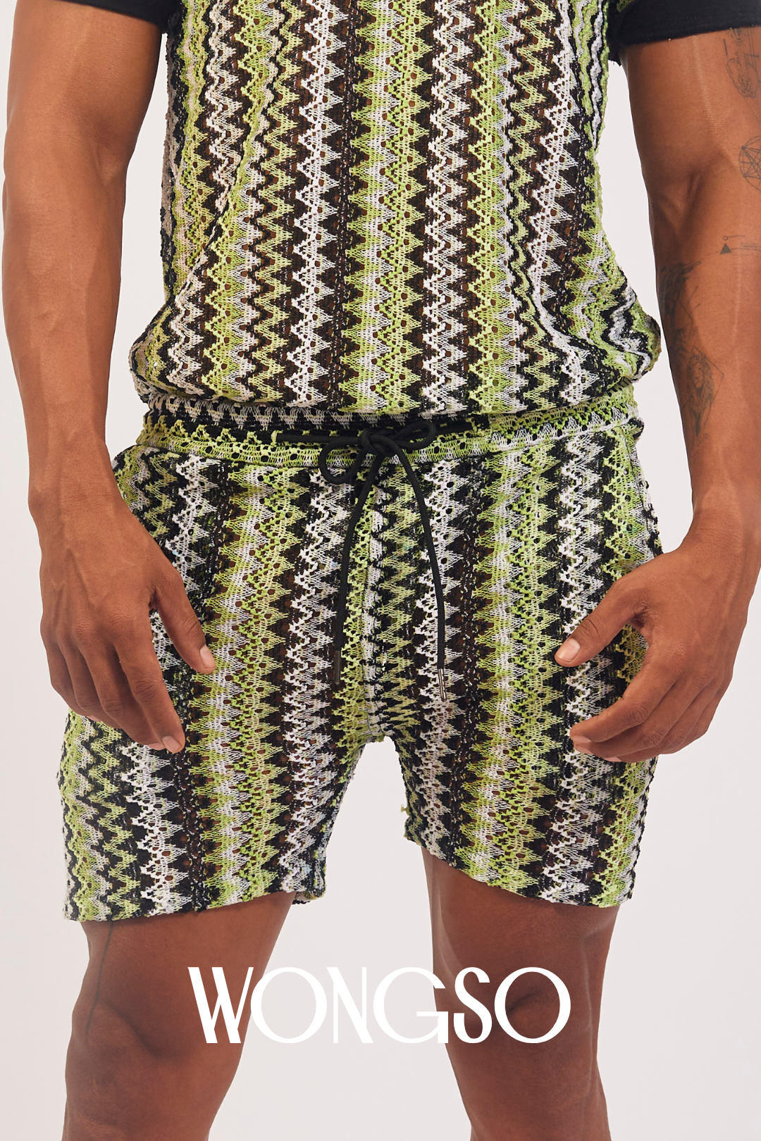 Model styling Boheme Green Lace Shorts with green polo shirts