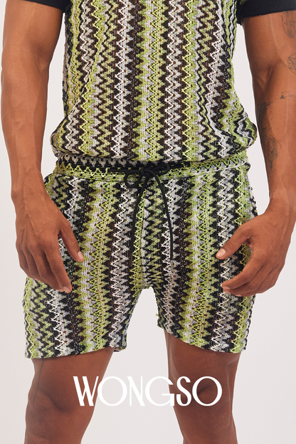 Model styling Boheme Green Lace Shorts with green polo shirts