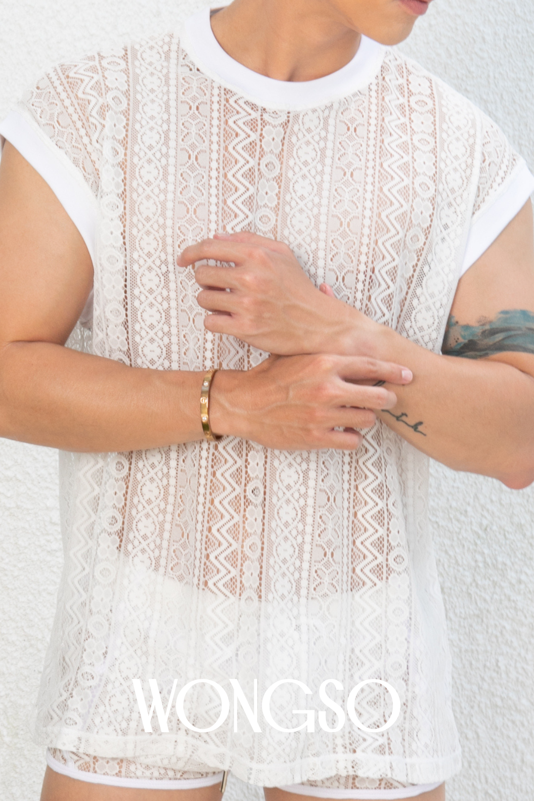 White sleeveless lace shirt for men – sheer elegance with a bold twist